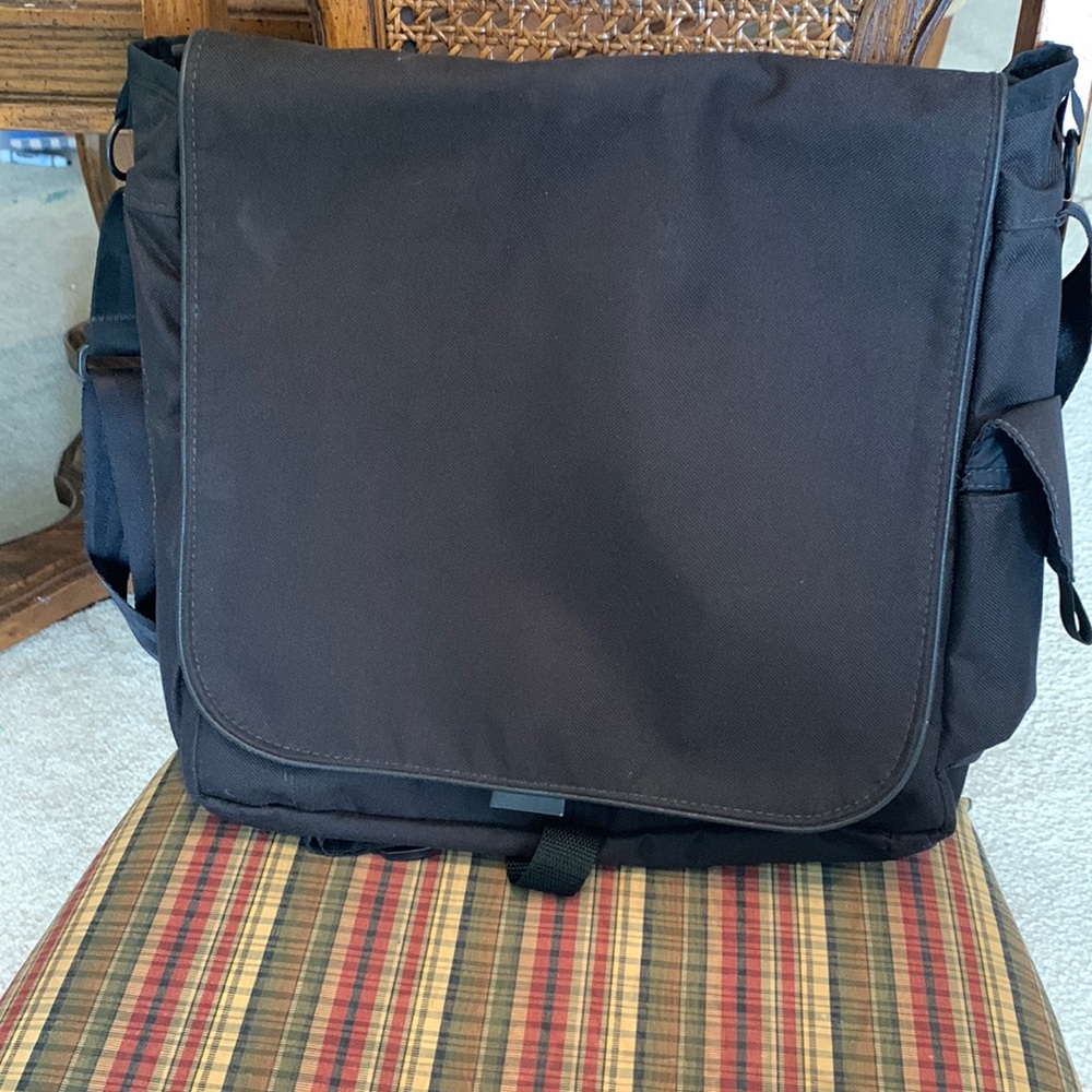 Black canvas gender neutral diaper bag, lots of pockets